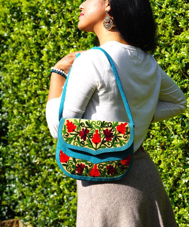 Beautiful handmade women's crossbody bag with floral embroidery design for chic boho style. 