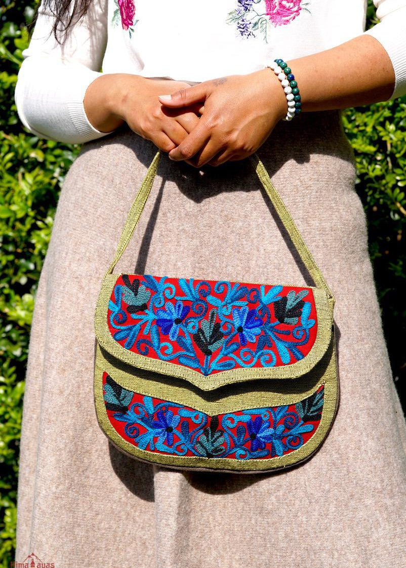 Beautiful hand embroidered crossbody bag with bright and multi-colour embroidered floral patterns.