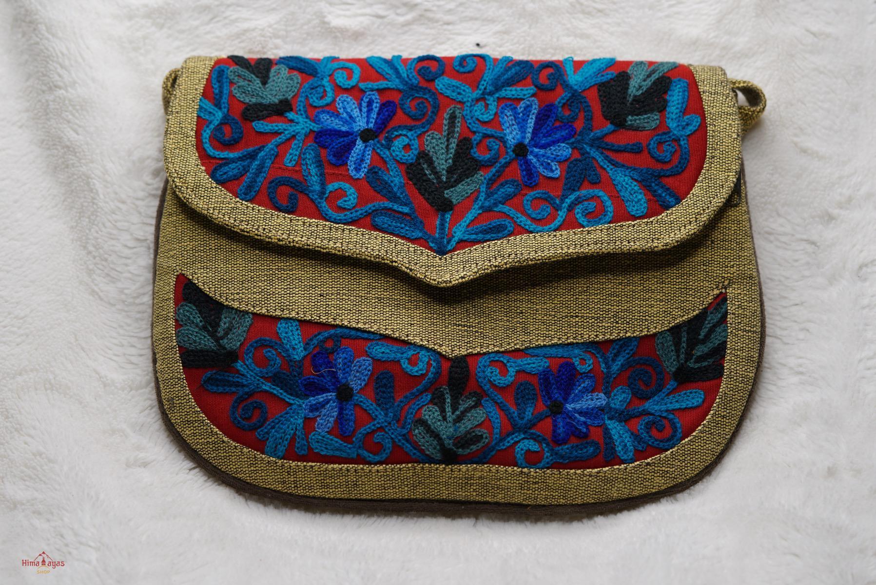 Beautiful hand embroidered crossbody bag with bright and multi-colour embroidered floral patterns.