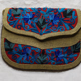Beautiful hand embroidered crossbody bag with bright and multi-colour embroidered floral patterns.