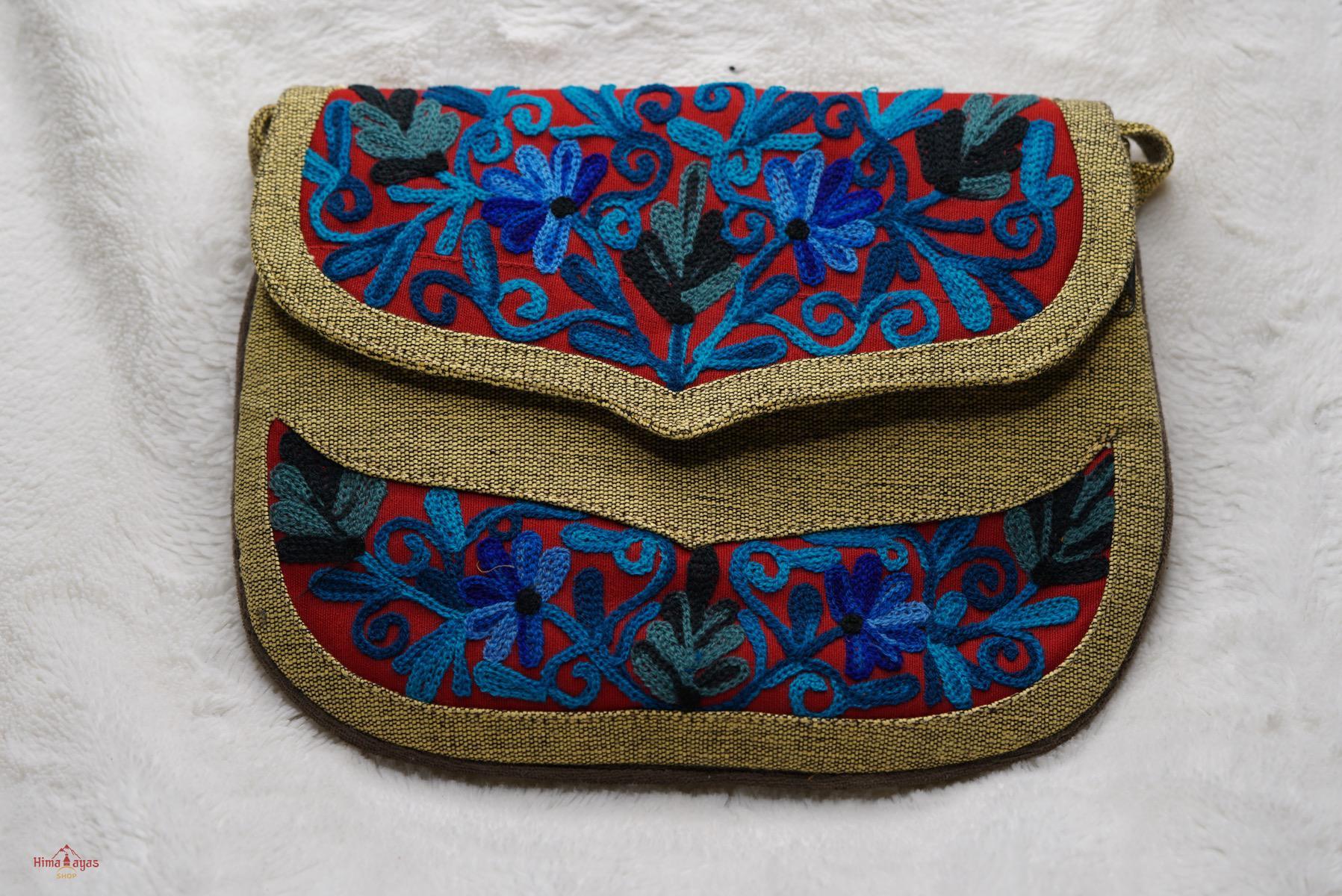 Beautiful hand embroidered crossbody bag with bright and multi-colour embroidered floral patterns.