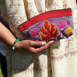A special women pouch very light weight, ideal as a makeup bag or everyday use hand purse.