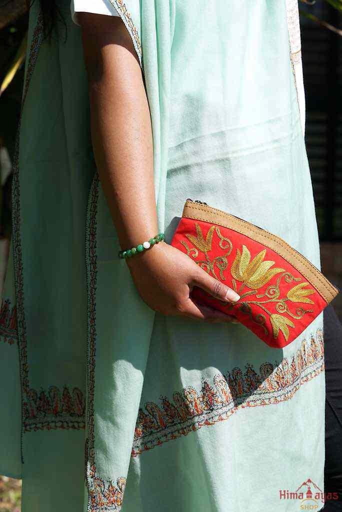 Beautiful Cashmere design pouch made with hand-embroidery design with a very fine embellishment that involves elaborate and intricate floral motifs. 