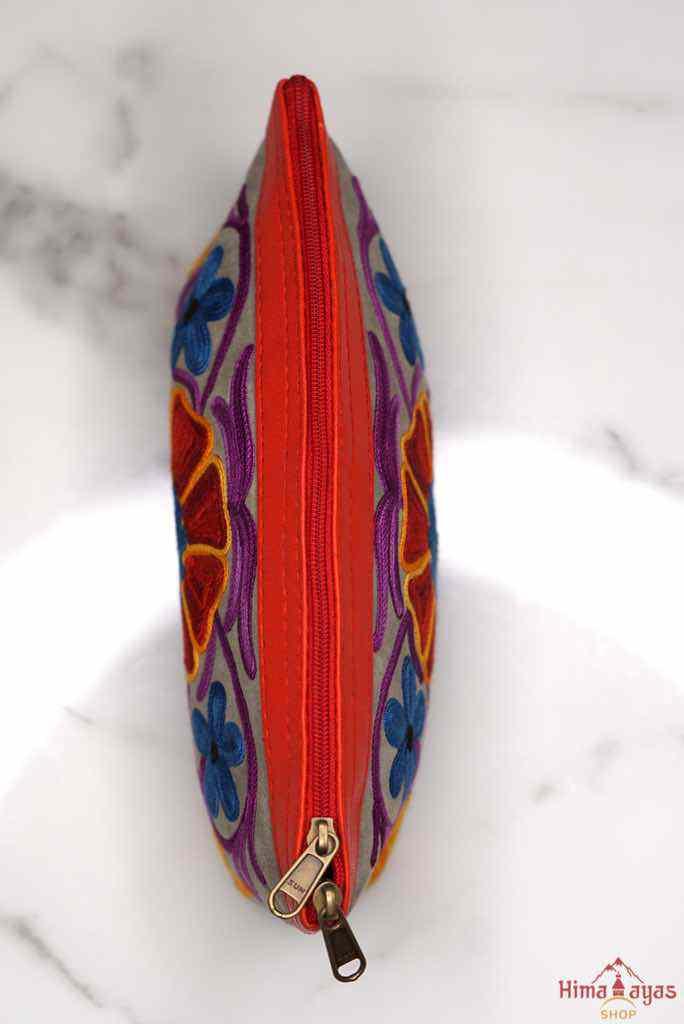 A nature inspired hand-embroidered zipper pouch, ideal as a cosmetic bag or travel essentials for everyday use.
