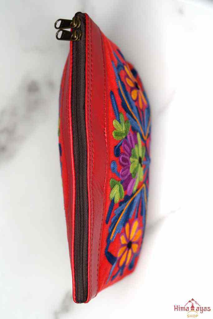 Beautiful Cashmere design pouch made with hand-embroidery design with a very fine embellishment that involves elaborate and intricate floral motifs. 