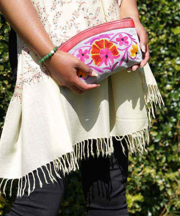 Women pouch purse with floral pattern, ultra-soft and lightweight. The pouch can be used as makeup bag or clutch that suit your style. Ethically made in Nepal.