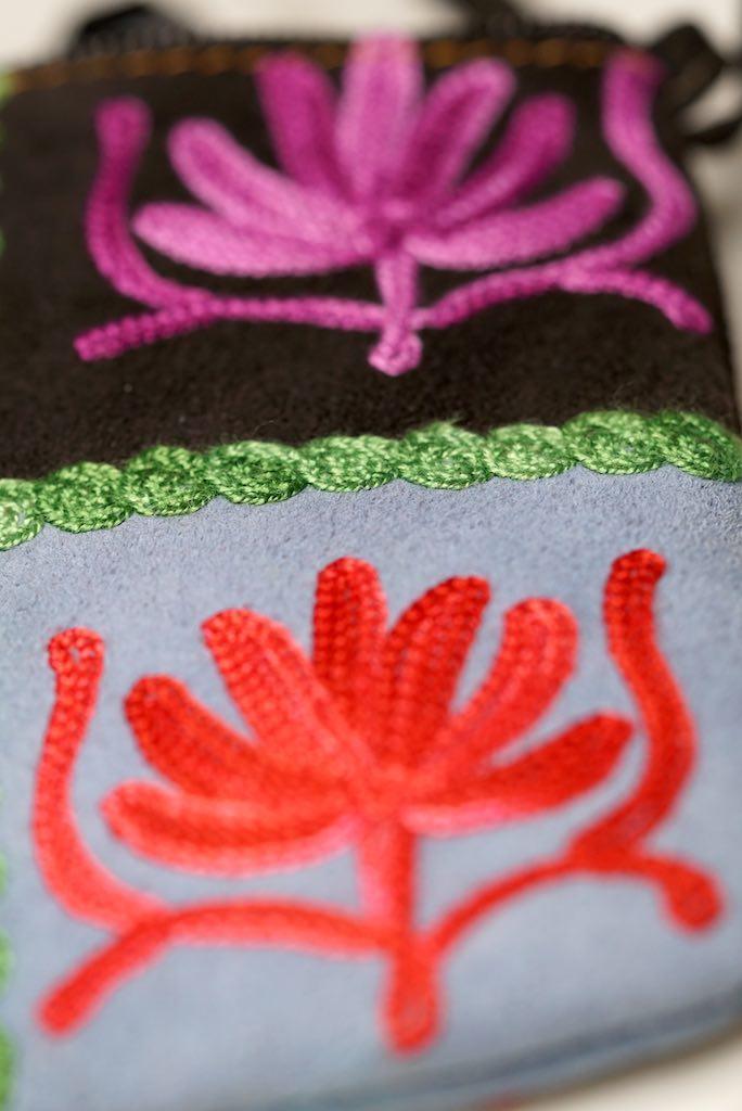 A stylist wristlet women purse for everyday use, handmade and kashmiri embroidery design for boho style. 