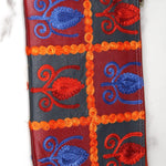 Vibrant colorful purse with kashmiri hand embroidery, has a secure zip top closure, ethically made in Nepal.