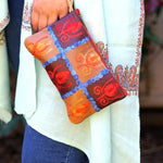 Vibrant colorful purse with kashmiri hand embroidery, has a secure zip top closure, ethically made in Nepal.
