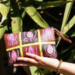 Vibrant colorful purse with kashmiri hand embroidery, has a secure zip top closure, ethically made in Nepal.