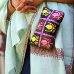 Vibrant colorful purse with kashmiri hand embroidery, has a secure zip top closure, ethically made in Nepal.Vibrant colorful purse with kashmiri hand embroidery, has a secure zip top closure, ethically made in Nepal.