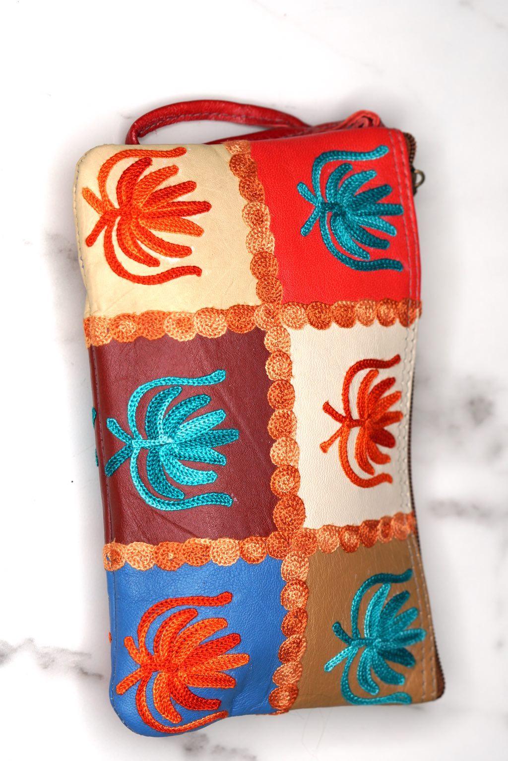 A stylist wristlet women purse for everyday use, handmade and kashmiri embroidery design for boho style. 