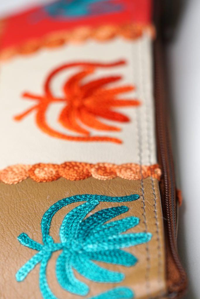 A stylist wristlet women purse for everyday use, handmade and kashmiri embroidery design for boho style. 