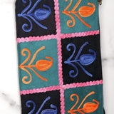 Unique style purse with cashmere handwork embroidery that comes with a wristlet and a secure zip top closure.