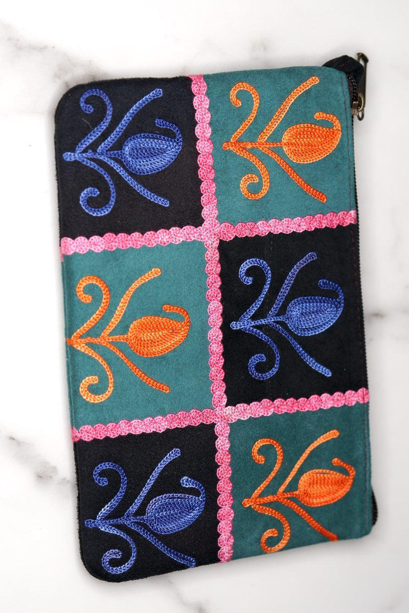 Unique style purse with cashmere handwork embroidery that comes with a wristlet and a secure zip top closure.