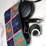 Unique style purse with cashmere handwork embroidery that comes with a wristlet and a secure zip top closure.