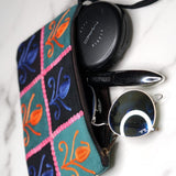 Unique style purse with cashmere handwork embroidery that comes with a wristlet and a secure zip top closure.