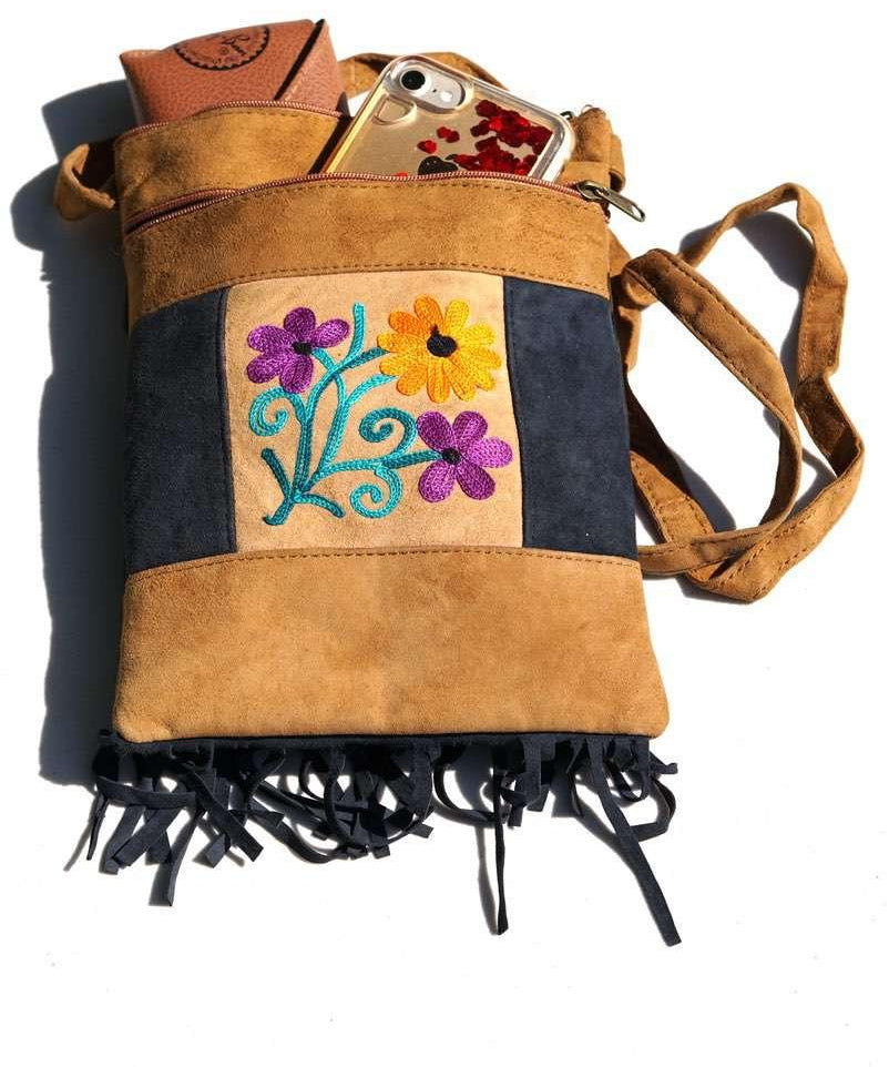Easy to carry side bag for women, features a beautiful hand embroidered floral pattern. 