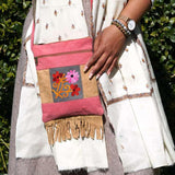 Easy to carry side bag for women, features a beautiful hand embroidered floral pattern. 
