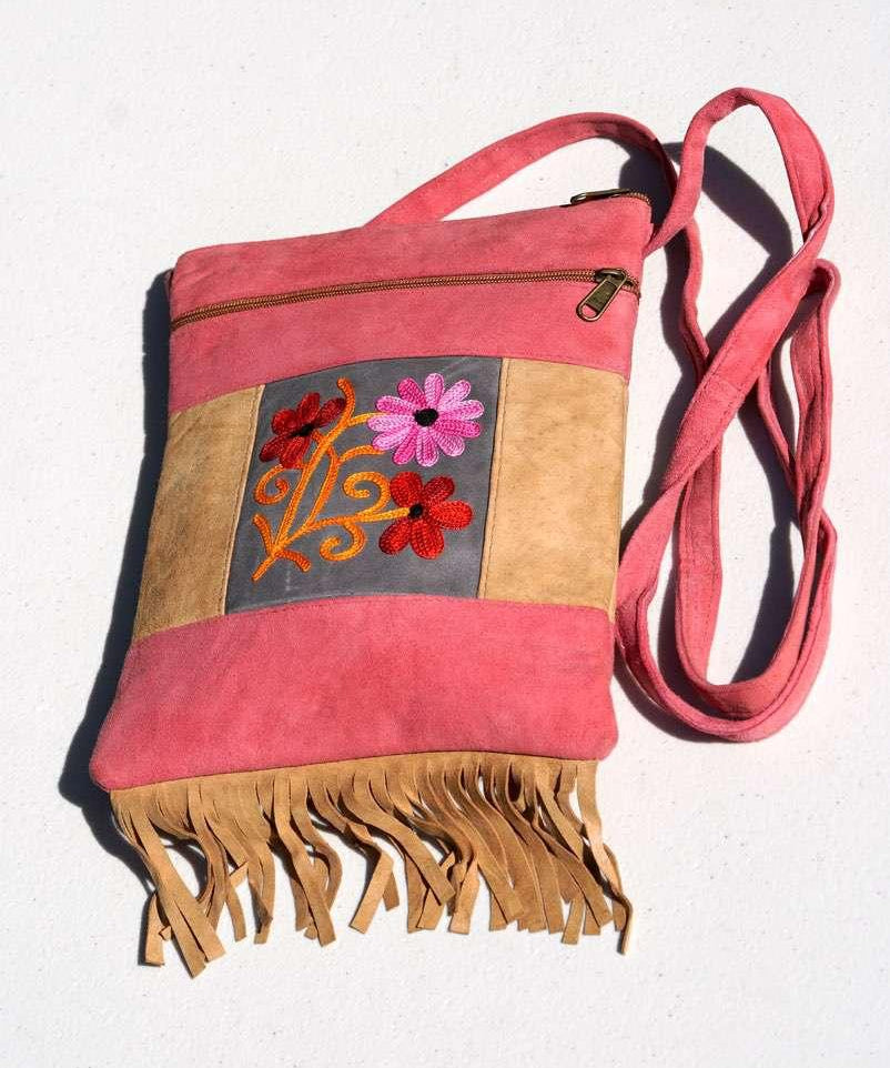 Easy to carry side bag for women, features a beautiful hand embroidered floral pattern. 