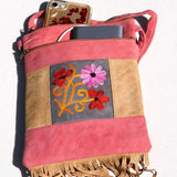 Easy to carry side bag for women, features a beautiful hand embroidered floral pattern. 