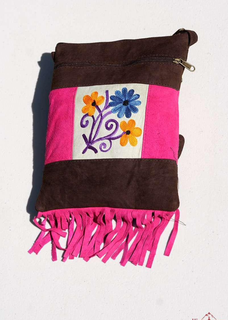 Easy to carry side bag for women, features a beautiful hand embroidered floral pattern. 