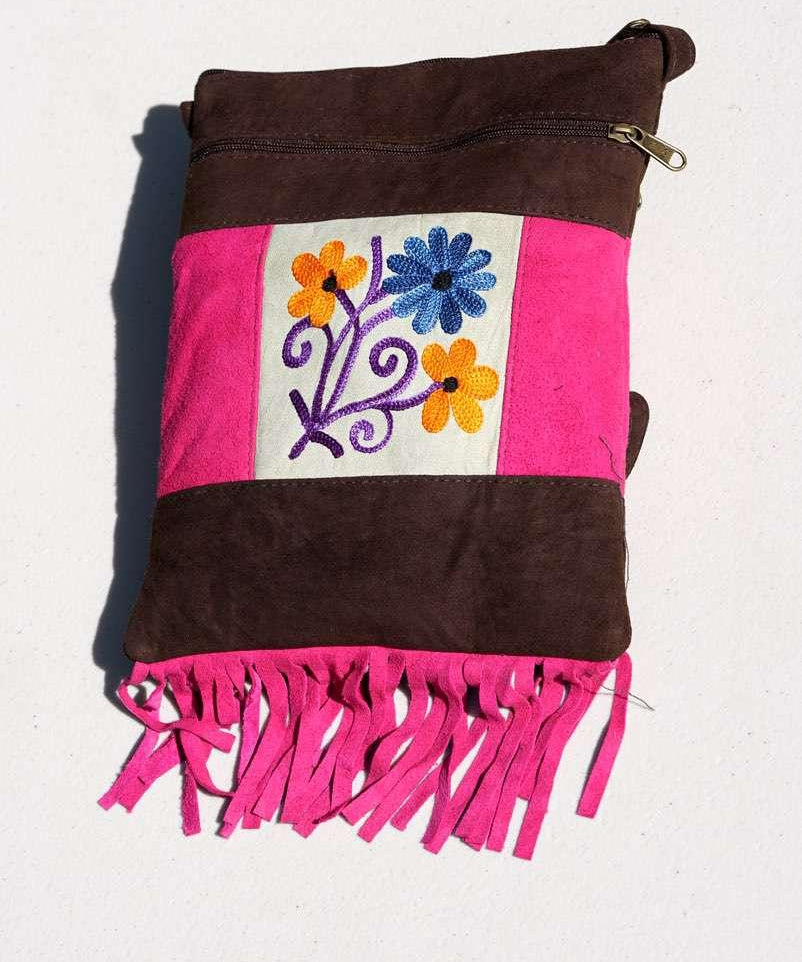 Easy to carry side bag for women, features a beautiful hand embroidered floral pattern. 