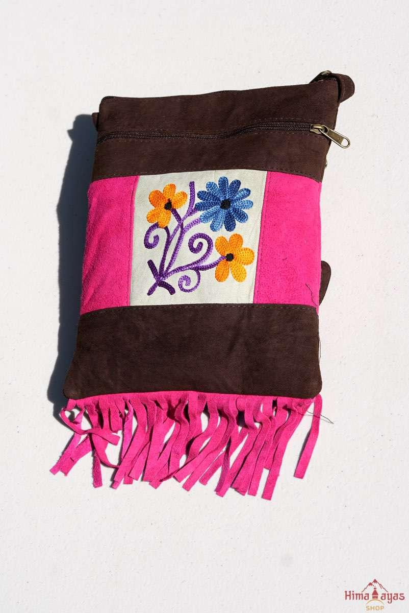 Easy to carry side bag for women, features a beautiful hand embroidered floral pattern. 