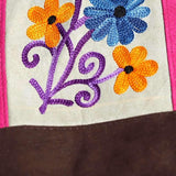 Easy to carry side bag for women, features a beautiful hand embroidered floral pattern. 