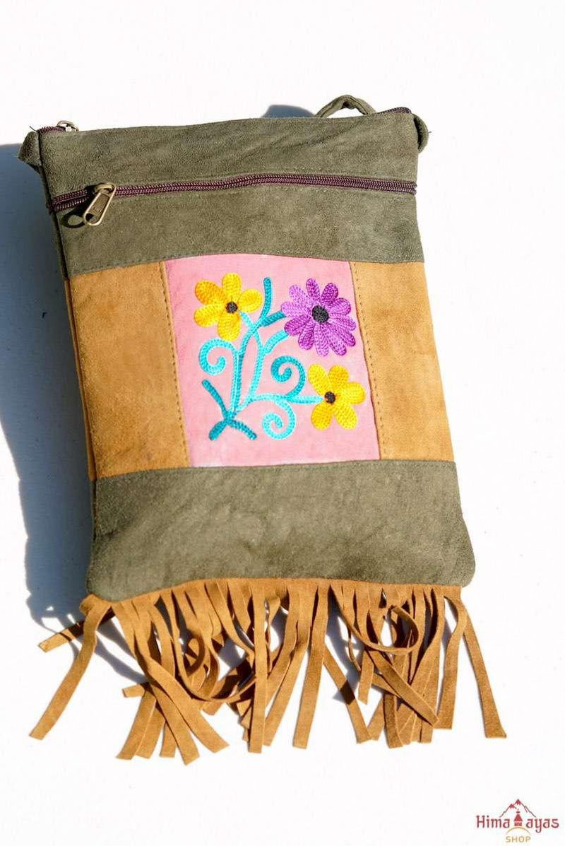 Easy to carry side bag for women, features a beautiful hand embroidered floral pattern. 
