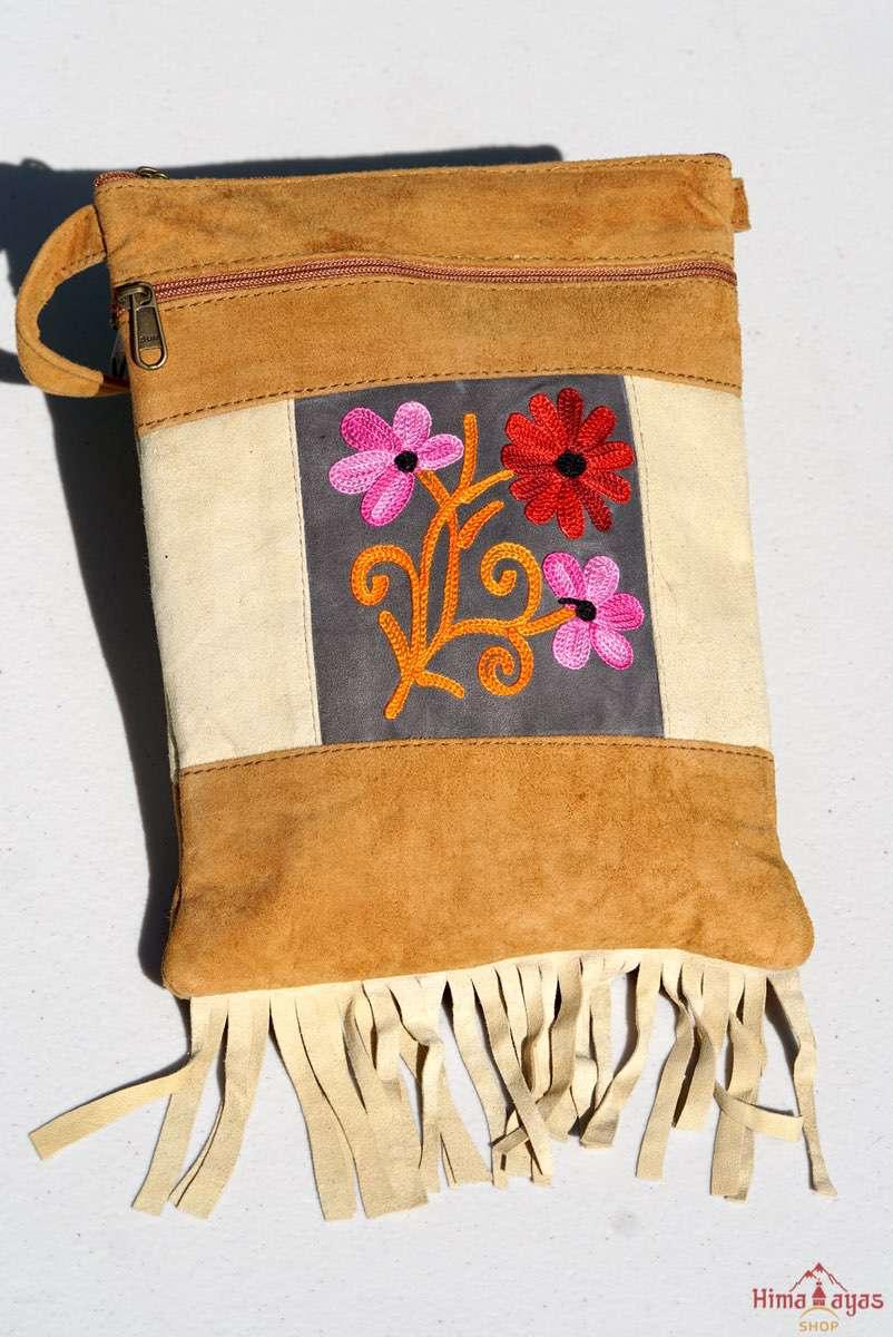 Easy to carry side bag for women, features a beautiful hand embroidered floral pattern. 
