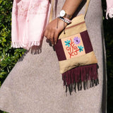 Easy to carry side bag for women, features a beautiful hand embroidered floral pattern. 