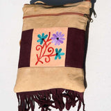 Easy to carry side bag for women, features a beautiful hand embroidered floral pattern. 