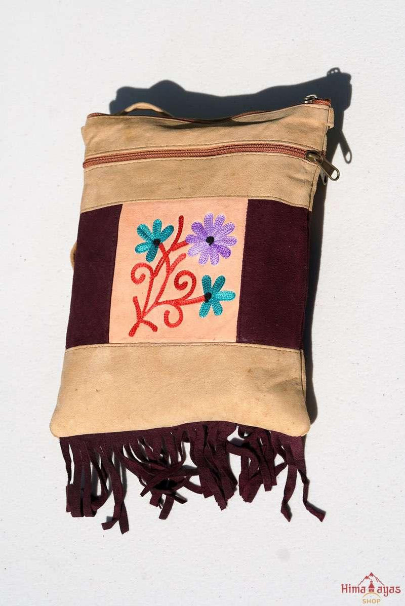 Easy to carry side bag for women, features a beautiful hand embroidered floral pattern. 