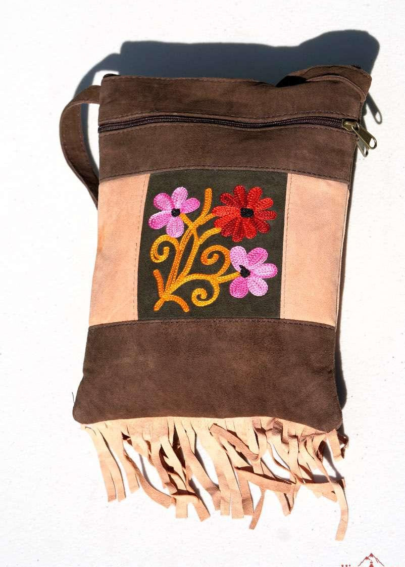 Absolutely stunning women's side bag with fringe/tassel to give you a bohemian chic look.