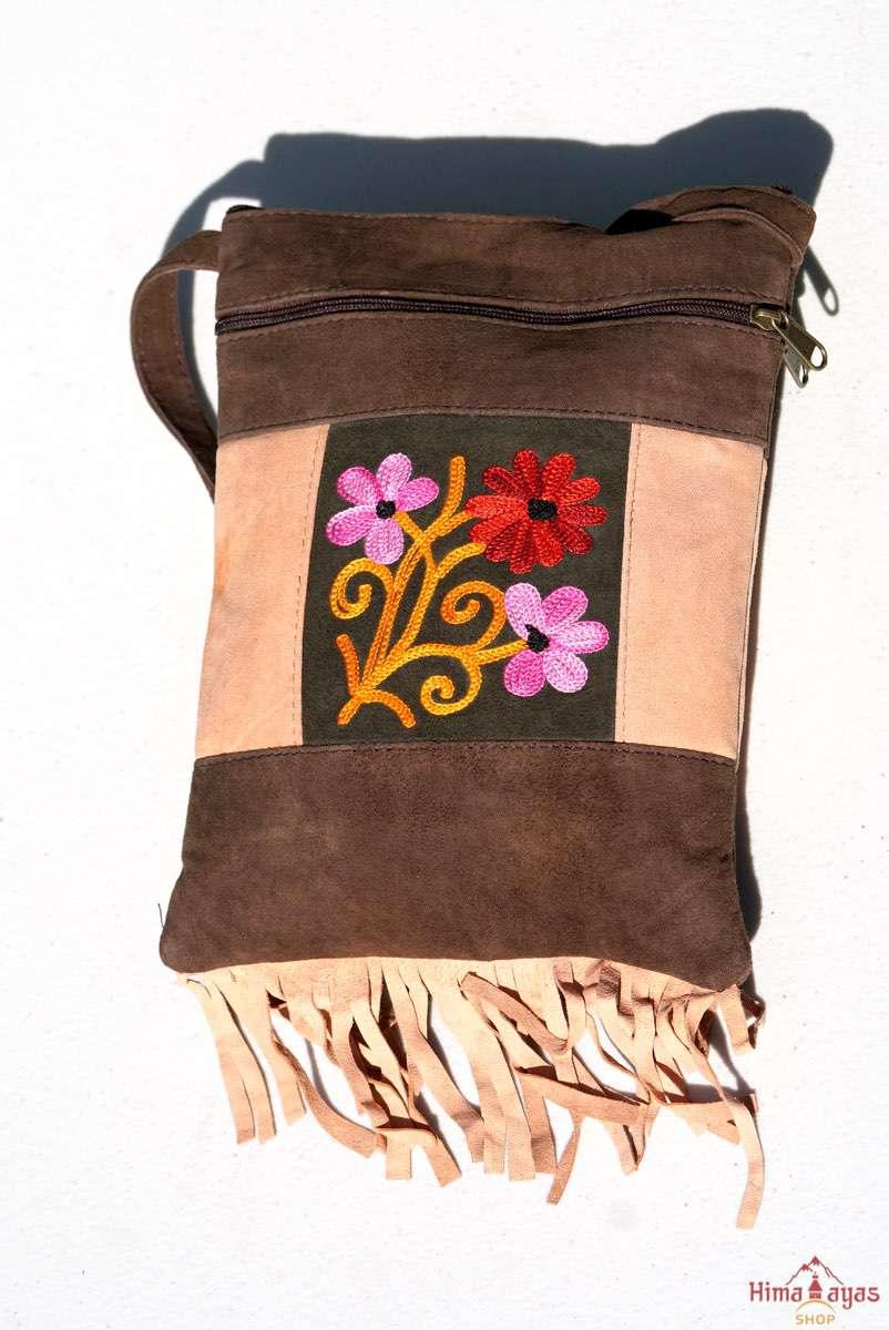 Absolutely stunning women's side bag with fringe/tassel to give you a bohemian chic look.
