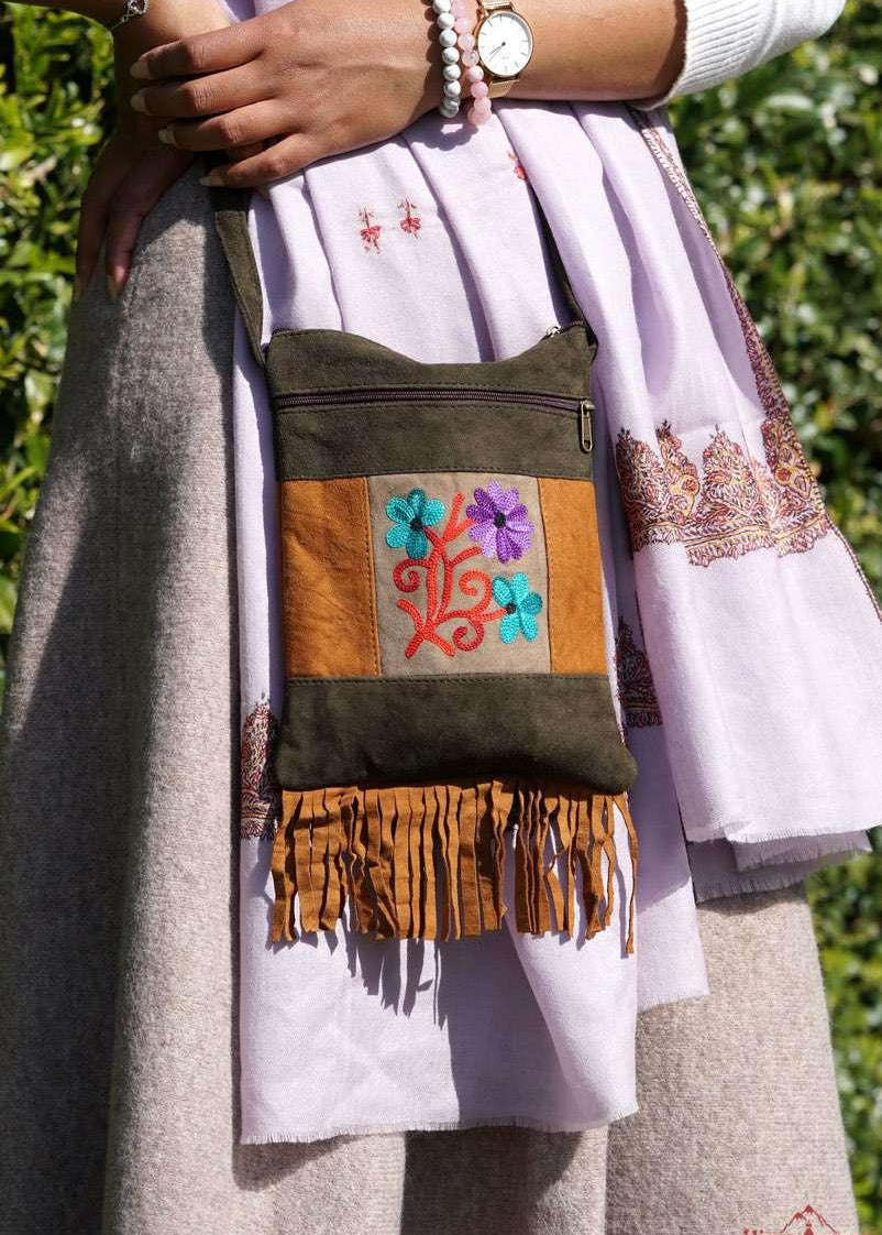 A unique style women's sling bag, crafted with beautiful cashmere floral embroidery to give it a chic stylish look.