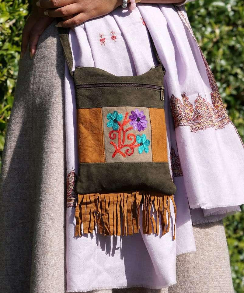 A unique style women's sling bag, crafted with beautiful cashmere floral embroidery to give it a chic stylish look.