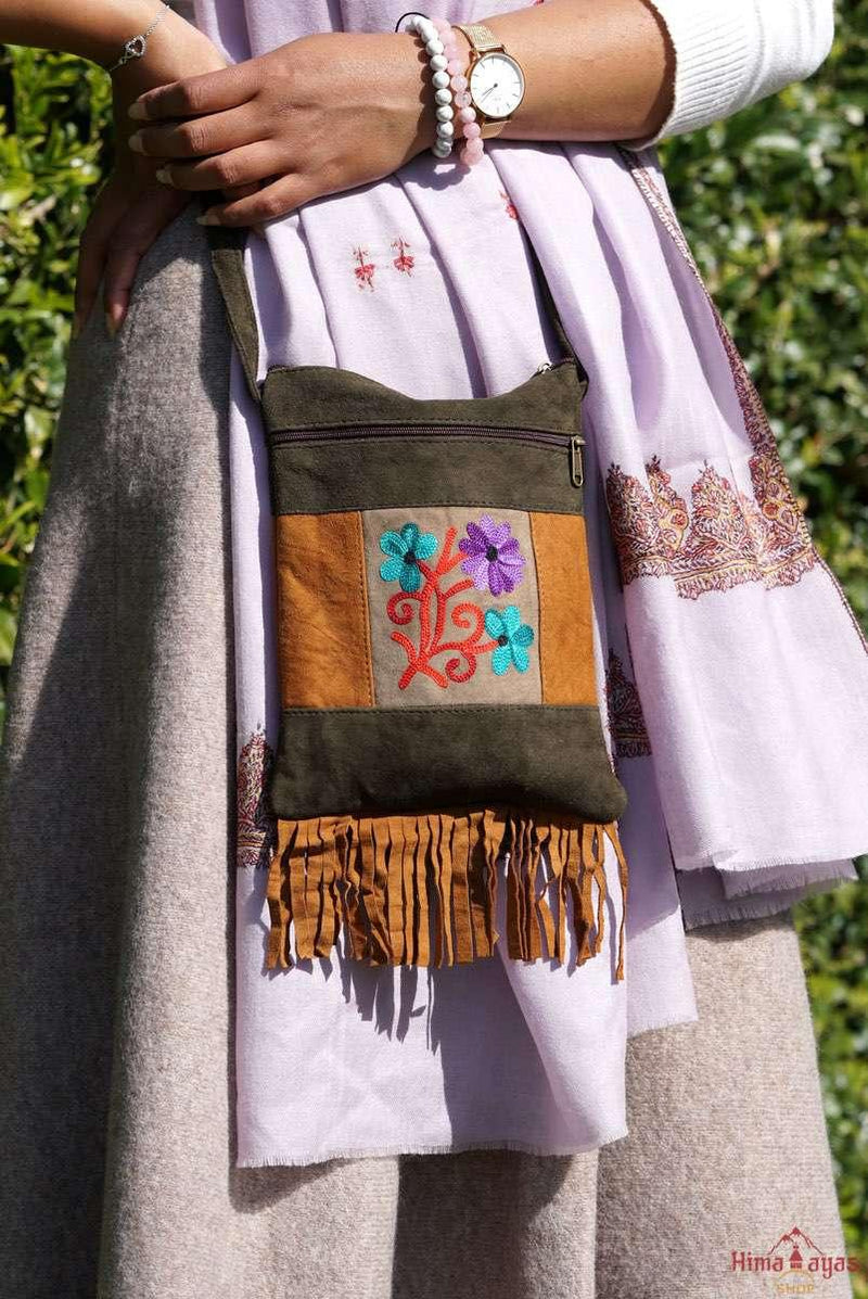 A unique style women's sling bag, crafted with beautiful cashmere floral embroidery to give it a chic stylish look.