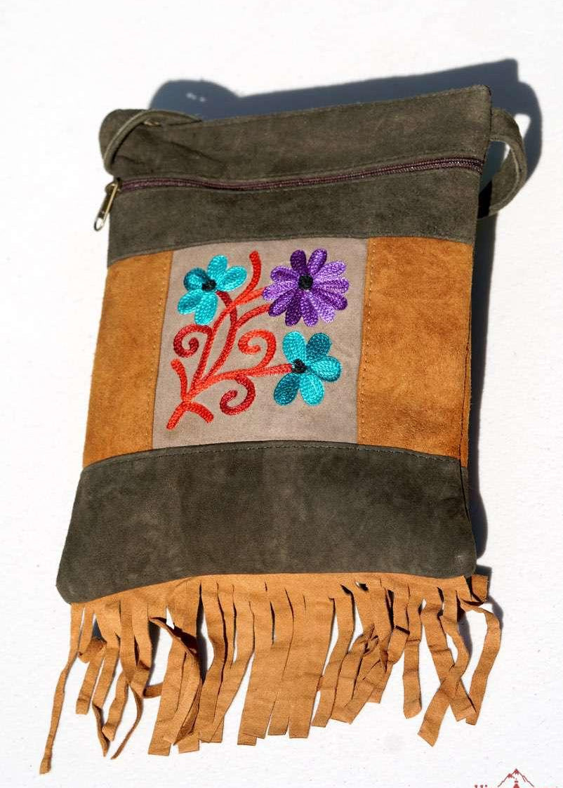 A unique style women's sling bag, crafted with beautiful cashmere floral embroidery to give it a chic stylish look.