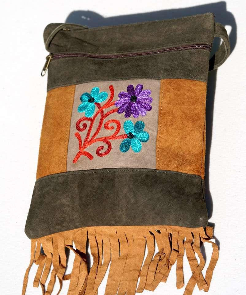A unique style women's sling bag, crafted with beautiful cashmere floral embroidery to give it a chic stylish look.