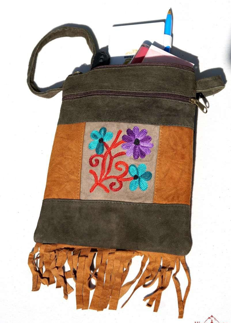 A unique style women's sling bag, crafted with beautiful cashmere floral embroidery to give it a chic stylish look.