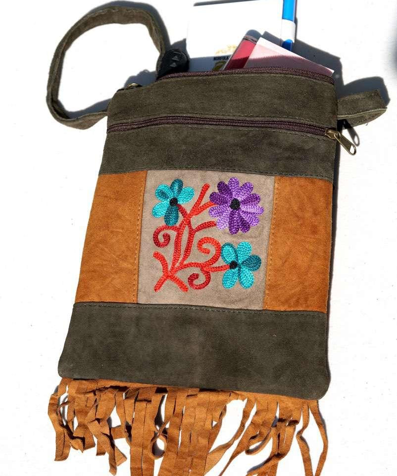 A unique style women's sling bag, crafted with beautiful cashmere floral embroidery to give it a chic stylish look.