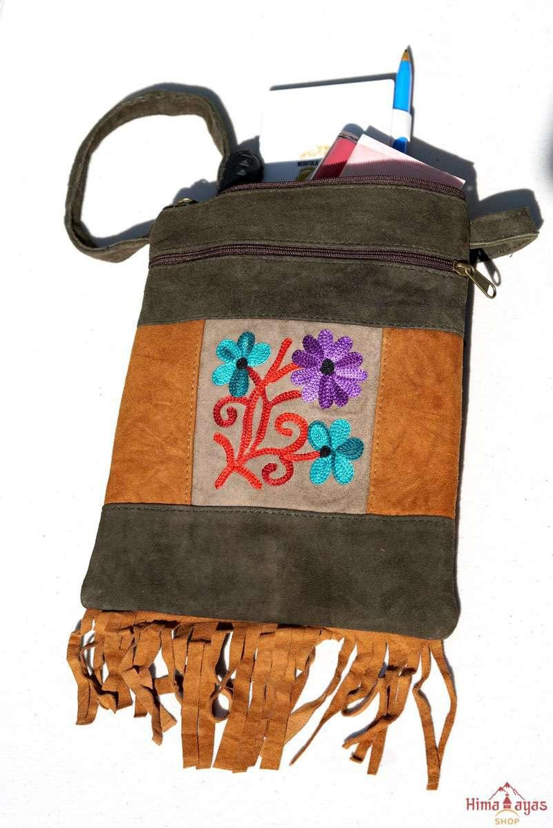 A unique style women's sling bag, crafted with beautiful cashmere floral embroidery to give it a chic stylish look.