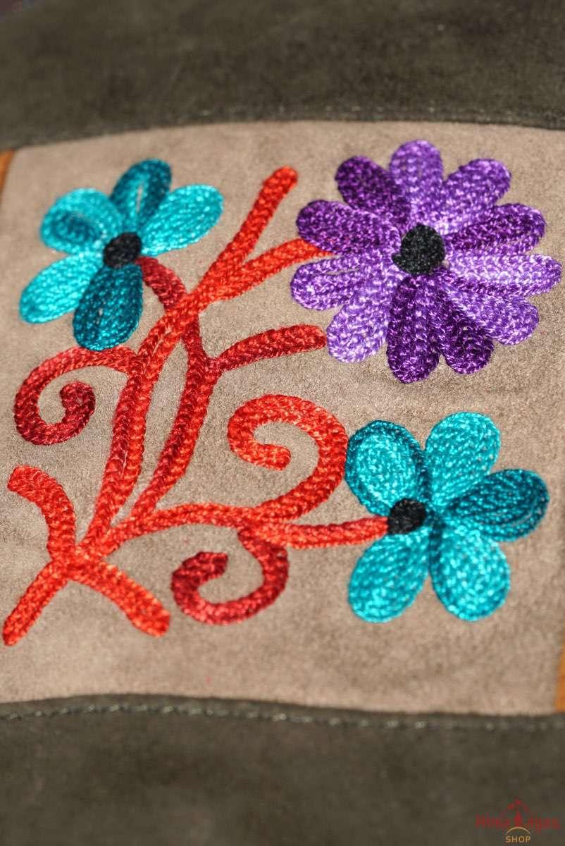 A unique style women's sling bag, crafted with beautiful cashmere floral embroidery to give it a chic stylish look.