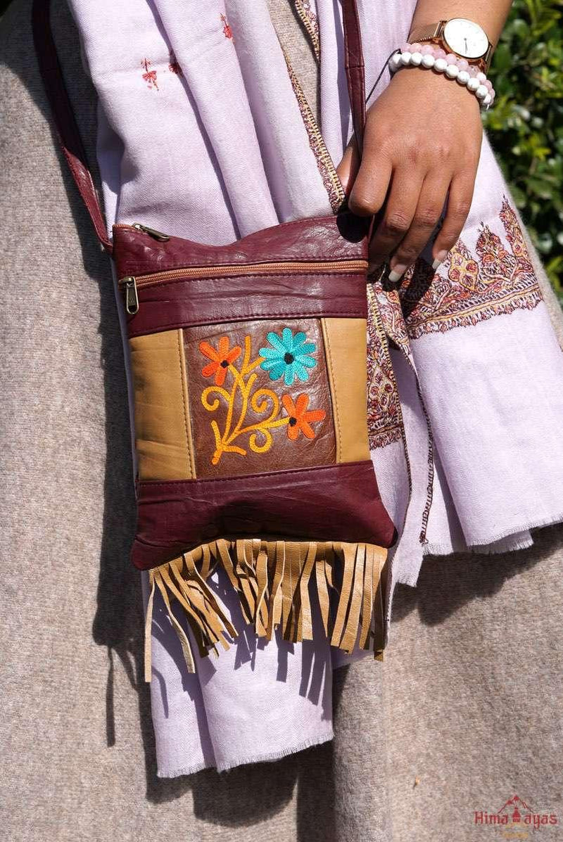 A unique style women's crossbody bag with fringe, crafted ethically from Himalayas.