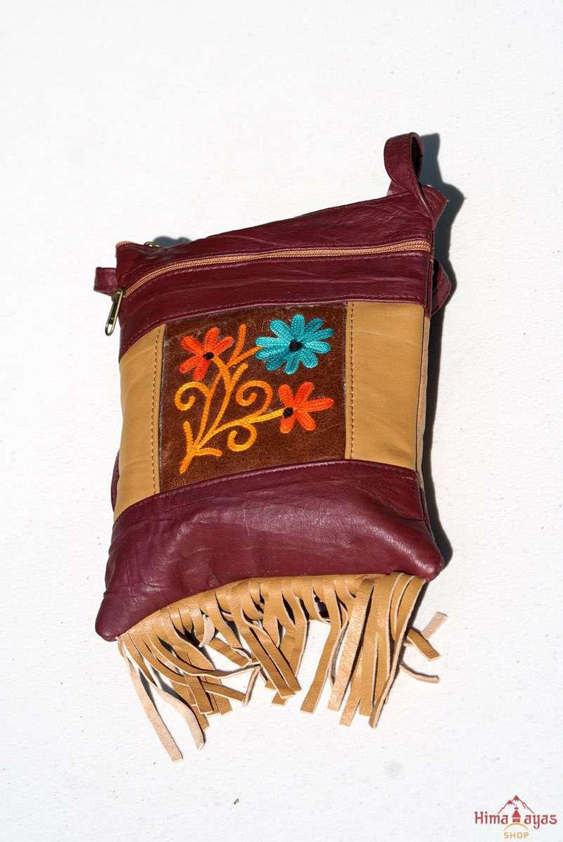 A unique style women's crossbody bag with fringe, crafted ethically from Himalayas.