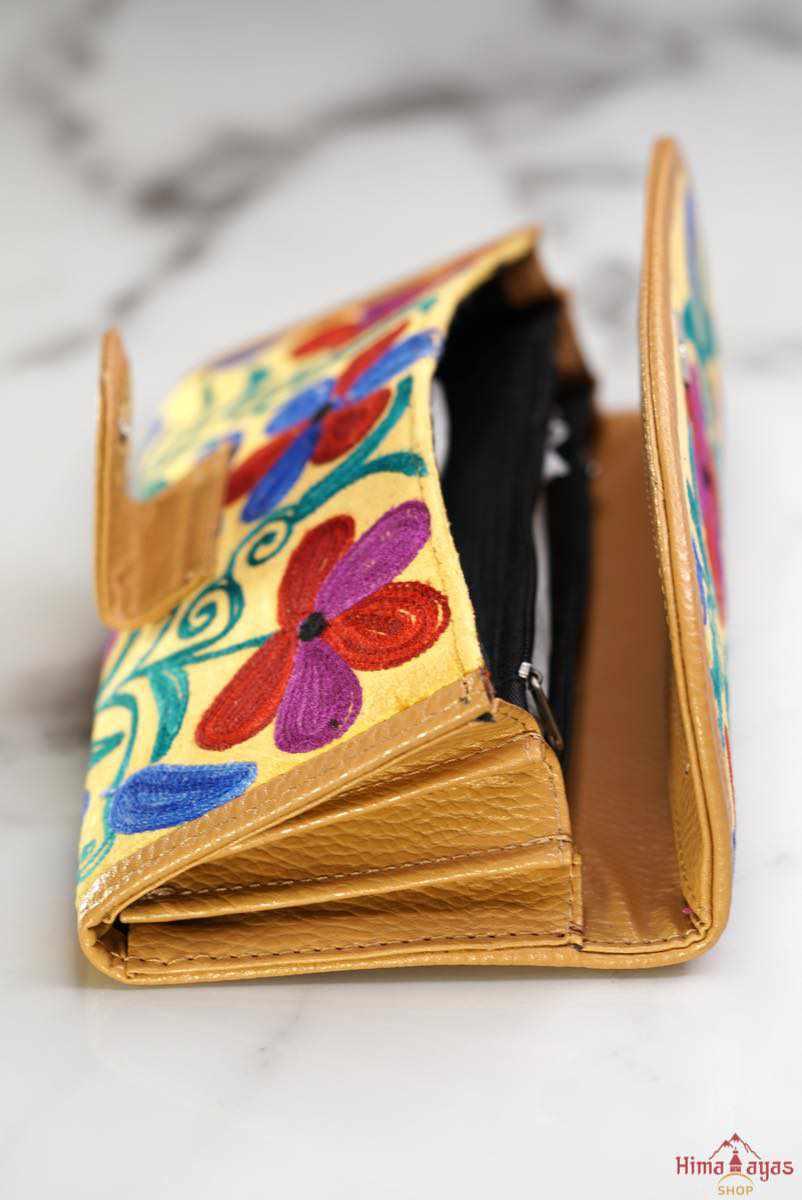  This stunning piece of handcrafted wallet is specially designed with Kashmiri style hand-embroidery. Perfect for everyday use, you can organize your money and cards perfectly in this wallet.
