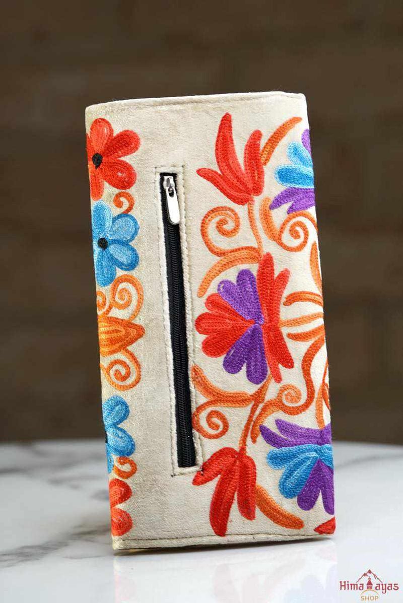 This stunning piece of handcrafted wallet is specially designed with Kashmiri style hand-embroidery. Perfect for everyday use, you can organize your money and cards perfectly in this wallet.