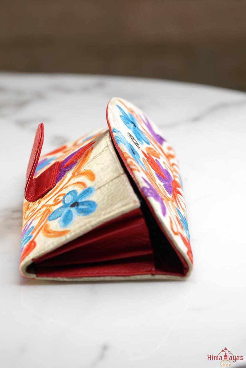 This stunning piece of handcrafted wallet is specially designed with Kashmiri style hand-embroidery. Perfect for everyday use, you can organize your money and cards perfectly in this wallet.